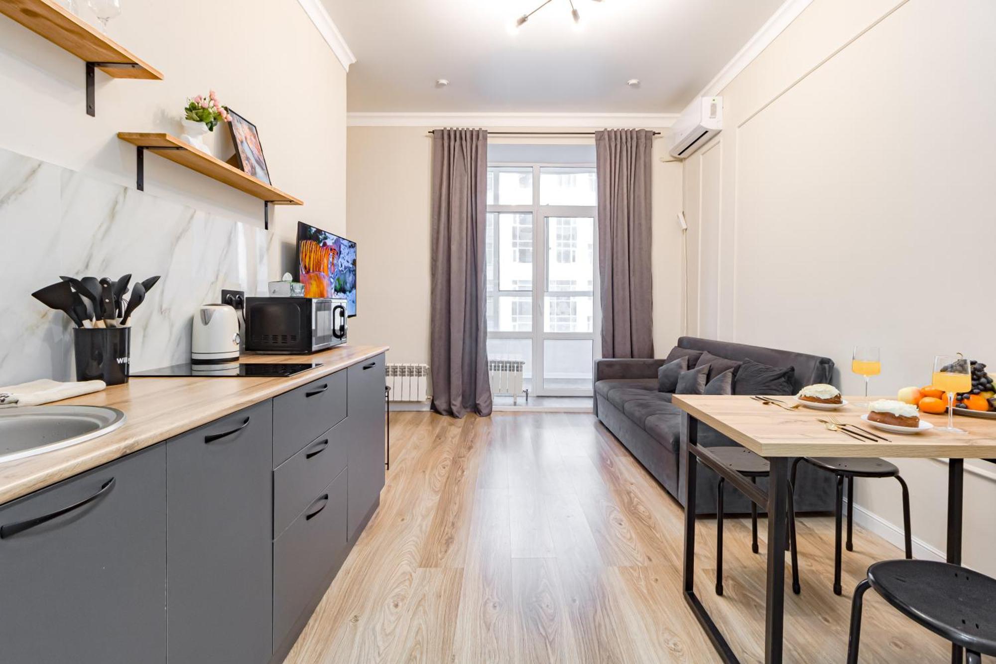 уютные в центре города жк Alpamys возде ботанического сада Apartment
